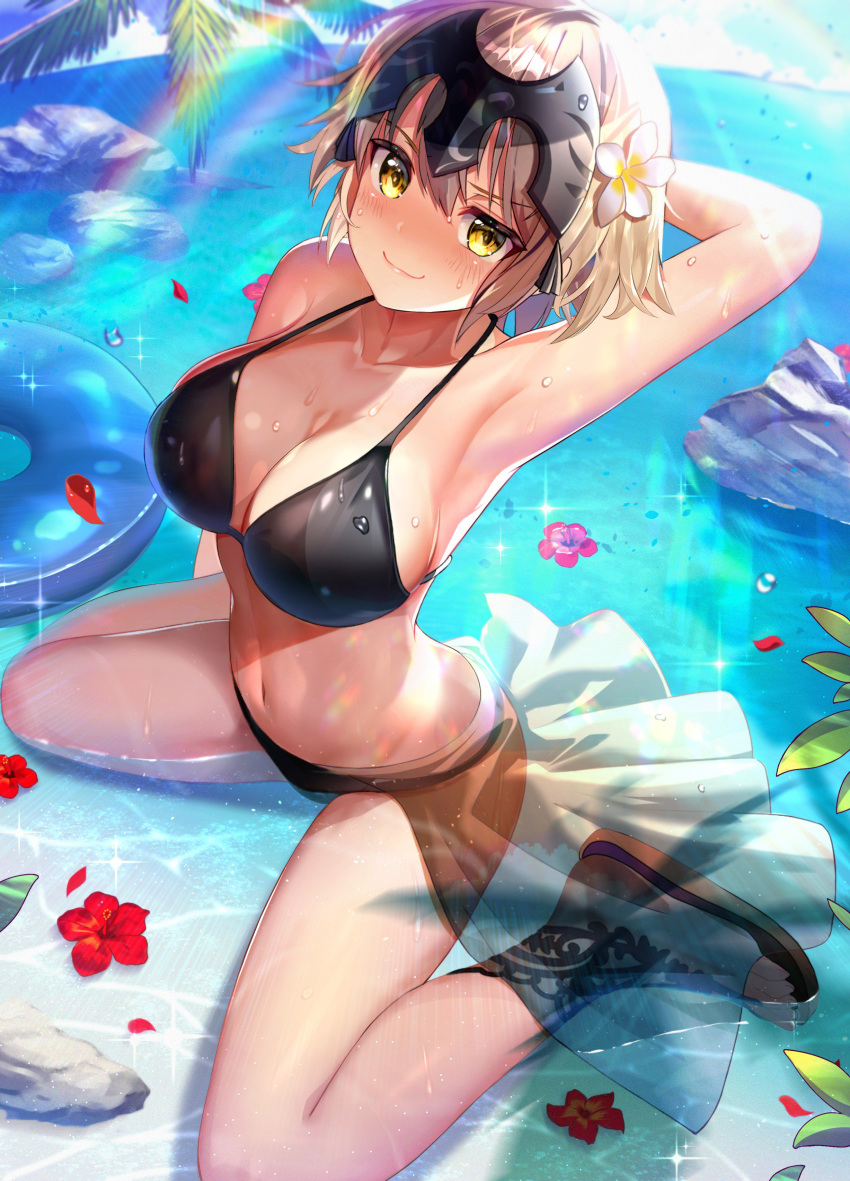 absurdres arched_back arm_behind_head arm_up armpits bangs bare_arms bare_legs bare_shoulders bikini black_bikini blonde_hair blue_sky blush breasts cleavage closed_mouth cloud collarbone commentary_request day eyebrows_visible_through_hair fate/grand_order fate_(series) flower from_above full_body hair_between_eyes hair_flower hair_ornament headpiece hibiscus highres horizon innertube jeanne_d'arc_(alter)_(fate) jeanne_d'arc_(fate)_(all) large_breasts looking_at_viewer navel nayuta_(una) ocean outdoors palm_tree petals petals_on_liquid rainbow red_flower rock sandals sarong see-through shadow shiny shiny_skin short_hair sidelocks sitting skirt sky smile smug solo sparkle stomach sunlight swimsuit tree wariza water_drop wet white_flower white_skirt yellow_eyes