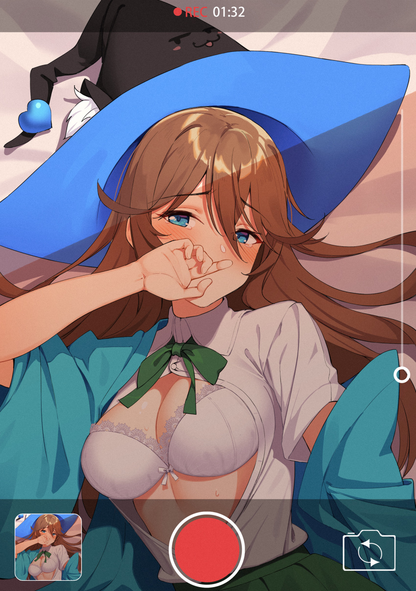 :3 blue_eyes blush breasts brown_hair cellphone character_request collared_shirt copyright_request covered_mouth embarrassed eyebrows_visible_through_hair from_above hair_between_eyes hair_flaps hat heart highres icarus_(632247131) large_breasts long_hair looking_at_viewer lying navel neck_ribbon on_back on_bed open_clothes open_shirt phone photo_(object) ribbon shirt skirt smartphone solo_focus tears unbuttoned unbuttoned_shirt upper_body viewfinder witch_hat