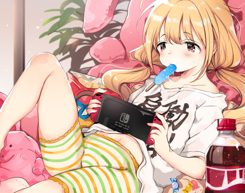 bangs bike_shorts blonde_hair blush brown_eyes clothes_writing cola food futaba_anzu idolmaster idolmaster_cinderella_girls long_hair low_twintails lying mouth_hold navel nintendo_switch no_no_yama off_shoulder on_back playing_games popsicle shirt shorts soda_bottle solo striped striped_bike_shorts striped_shorts stuffed_animal stuffed_bunny stuffed_toy t-shirt twintails you_work_you_lose