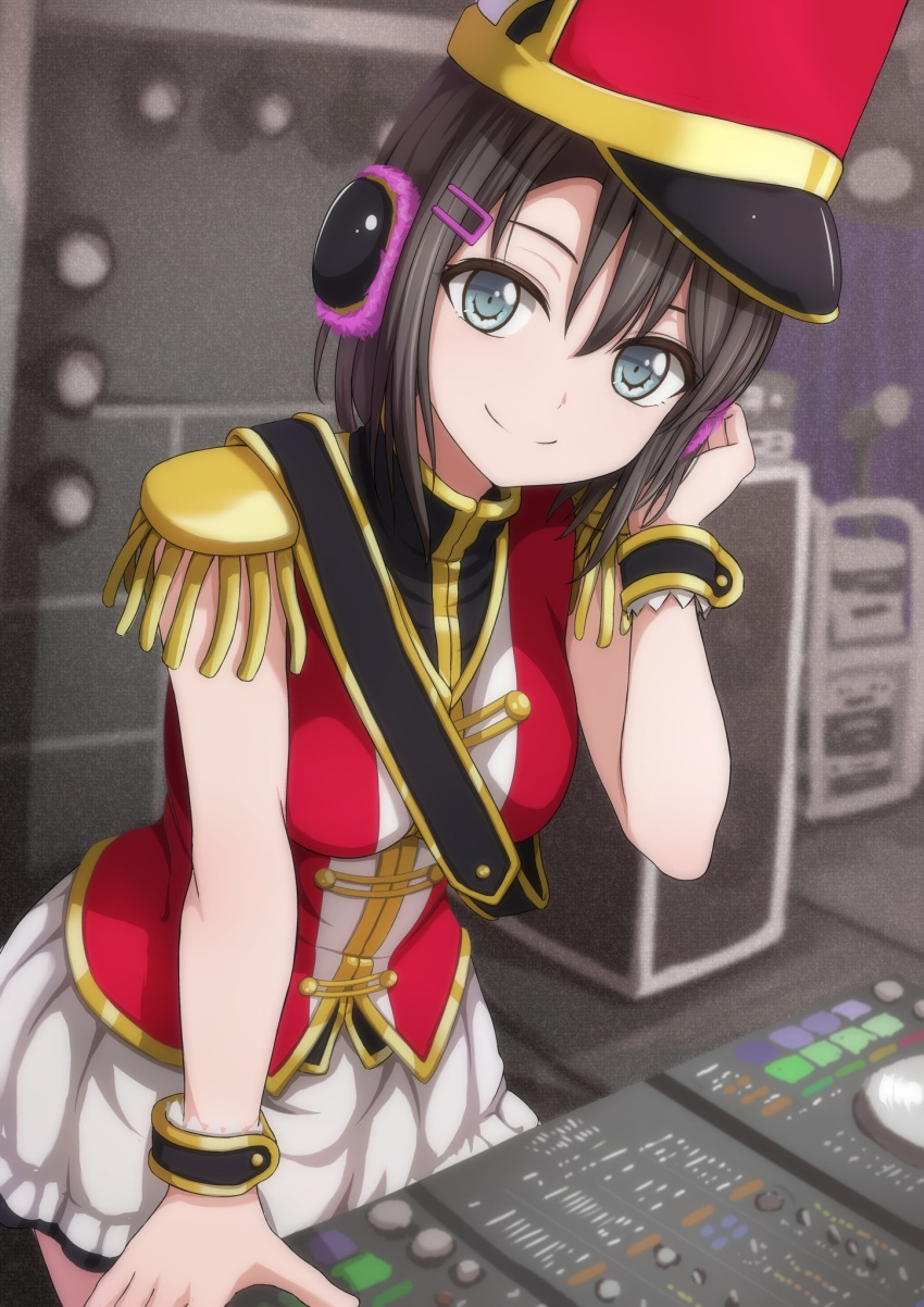 band_uniform bang_dream! bangs black_hair blue_eyes blurry blurry_background dj epaulettes hair_ornament hairclip hand_on_headphones hat headphones highres leaning_forward leaning_on_object looking_at_viewer mixing_table narafume okusawa_misaki sash shako_cap short_hair skirt smile solo stage_lights white_skirt wrist_cuffs