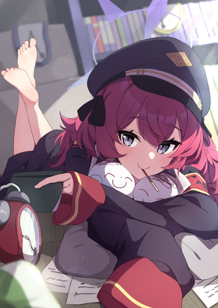 1girl alarm_clock armband barefoot black_coat blue_archive character_doll clock closed_mouth coat commentary_request crossed_bangs doodle_sensei_(blue_archive) dutch_angle eyelashes feet feet_up food grey_eyes grey_headwear halo hat highres holding hugging_object indoors iroha_(blue_archive) long_hair lying military_hat military_uniform on_stomach oversized_clothes paper pink_hair pocky purple_halo red_armband reikakrzk sensei_(blue_archive) shadow sleeves_past_wrists smile soles solo tatami the_pose toes uniform