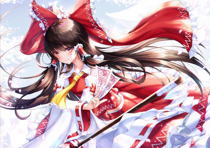 1girl ascot bangs bare_shoulders black_hair blush bow brown_eyes chyopeuteu commentary frilled_bow frilled_shirt_collar frills gohei hair_tubes hakurei_reimu highres holding long_hair long_sleeves looking_at_viewer midriff_peek ofuda petals petticoat red_bow red_skirt ribbon-trimmed_sleeves ribbon_trim sidelocks skirt skirt_set smile solo sparkle touhou wide_sleeves yellow_neckwear