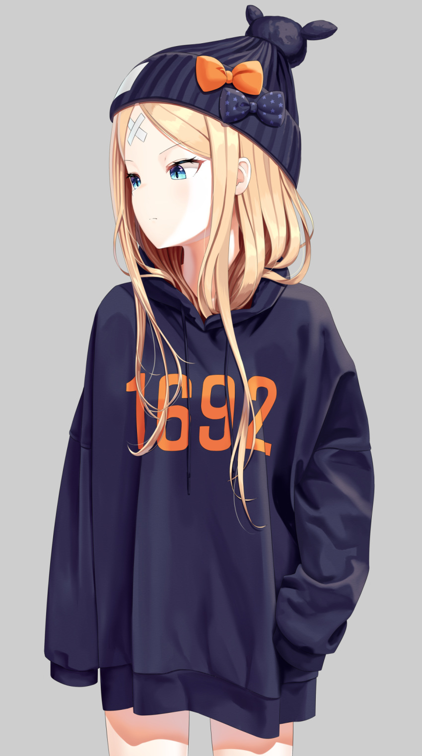 1girl abigail_williams_(fate/grand_order) bandaid_on_forehead bangs beanie black_bow black_headwear black_hoodie blonde_hair blue_eyes bow casual closed_mouth clothes_writing commentary_request cowboy_shot crossed_bandaids drawstring fate/grand_order fate_(series) grey_background hat hat_bow highres hood hood_down long_hair long_sleeves looking_away looking_to_the_side no_pants orange_bow parted_bangs sanbe_futoshi simple_background sleeves_past_fingers sleeves_past_wrists solo star star_print