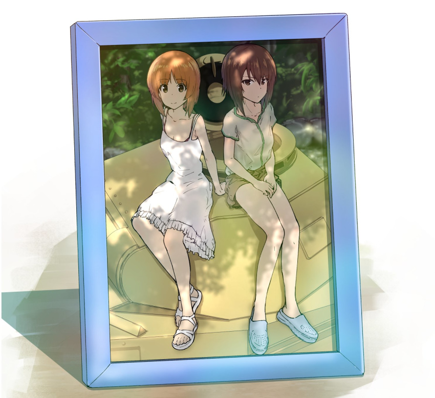 2girls arm_support bangs blue_footwear blurry blurry_background brown_eyes brown_hair brown_shorts casual closed_mouth commentary crocs dappled_sunlight day depth_of_field dress english_commentary english_text eyebrows_visible_through_hair frilled_dress frills girls_und_panzer goripan green_shirt ground_vehicle hands_on_lap highres light_frown looking_at_viewer medium_dress military military_vehicle motor_vehicle multiple_girls nishizumi_maho nishizumi_miho panzerkampfwagen_ii picture_(object) picture_frame plant sandals shirt short_hair short_shorts short_sleeves shorts siblings sisters sitting smile spaghetti_strap sundress sunlight tank white_footwear