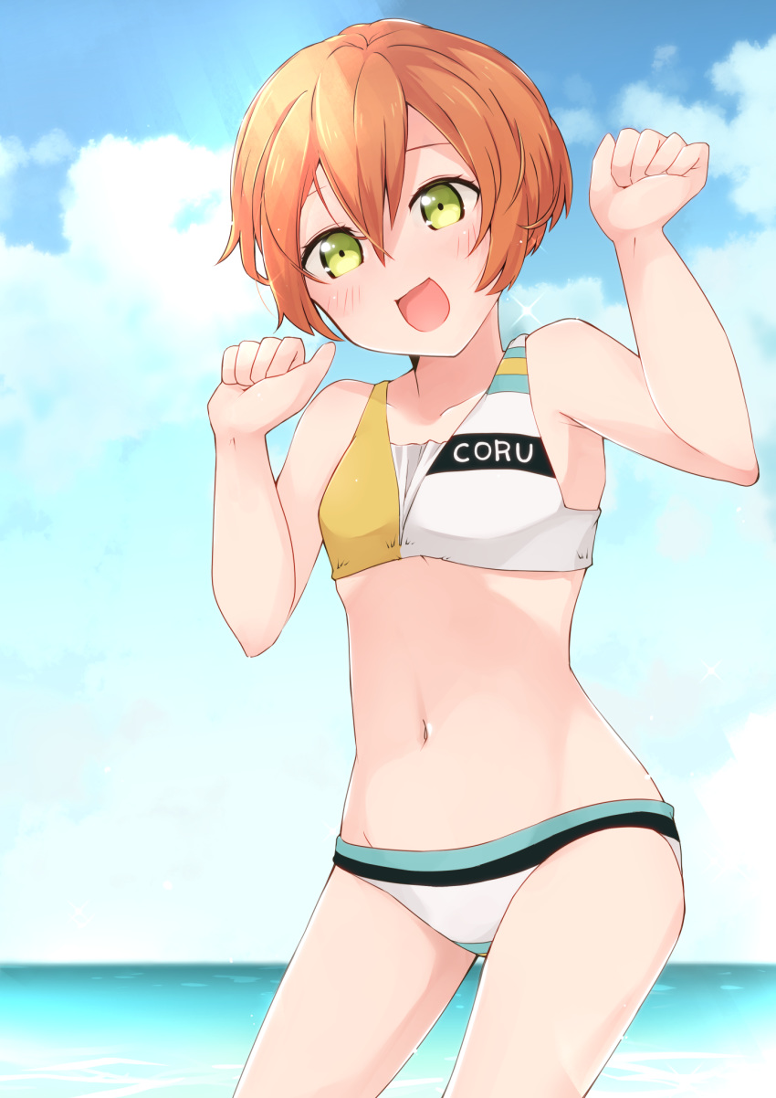 1girl :d bangs bare_arms bare_shoulders bikini blue_sky blush breasts clothes_writing cloud collarbone cowboy_shot day green_eyes groin hair_between_eyes hands_up highres hoshizora_rin legs_apart looking_at_viewer love_live! love_live!_school_idol_project misoradeko navel no_nose ocean open_mouth orange_hair outdoors short_hair sky small_breasts smile solo swimsuit water