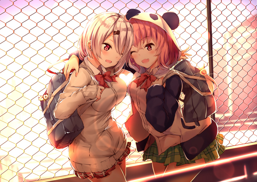 2girls ;d ahoge animal_ears arm_around_neck arm_around_shoulder bag bag_charm bangs blurry blurry_background blush bow bowtie breasts brown_hair cardigan chain-link_fence charm_(object) collared_shirt commentary depth_of_field dress_shirt earrings eye_contact eyebrows_visible_through_hair fake_animal_ears fang fence green_skirt grey_cardigan hair_between_eyes hood hood_up hooded_jacket jacket jewelry long_sleeves looking_at_another medium_breasts multiple_girls nijisanji one_eye_closed open_mouth outdoors panda_ears panda_hood plaid plaid_skirt pleated_skirt red_eyes red_neckwear red_skirt sasaki_saku school_bag shiina_yuika shirt silver_hair skirt sleeves_past_wrists smile sunset virtual_youtuber white_jacket white_shirt yukishiro_arute