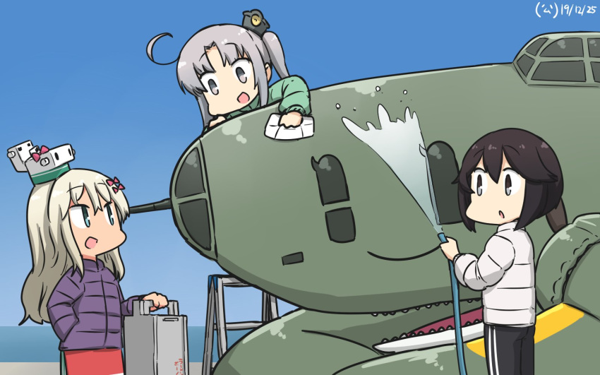 3girls akitsushima_(kantai_collection) black_hair blonde_hair blue_eyes blush bow coat dated eyebrows_visible_through_hair gradient_sky grecale_(kantai_collection) grey_hair hair_between_eyes hair_bow hair_ornament hair_ribbon hamu_koutarou hayasui_(kantai_collection) highres kantai_collection long_hair long_sleeves looking_at_viewer multiple_girls nishikitaitei-chan open_mouth pants ribbon short_hair side_ponytail sidelocks silver_eyes sky smile track_pants water winter_clothes winter_coat