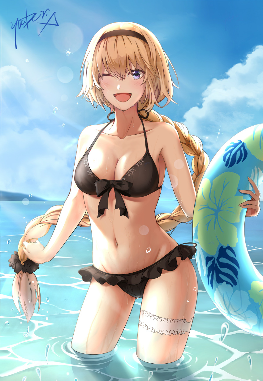 1girl ;d absurdres bangs bikini black_bikini black_bow black_hairband blonde_hair blue_eyes blue_sky bow braided_ponytail breasts cleavage cloud cowboy_shot day fate/grand_order fate_(series) floating_hair frilled_bikini_bottom groin hair_between_eyes hair_bow hairband halterneck highres holding holding_innertube innertube jeanne_d'arc_(fate)_(all) jeanne_d'arc_(swimsuit_archer) lens_flare long_hair looking_at_viewer medium_breasts navel one_eye_closed open_mouth outdoors print_bikini_top sideboob signature sky smile solo standing swimsuit thigh_strap very_long_hair wading yuber.x