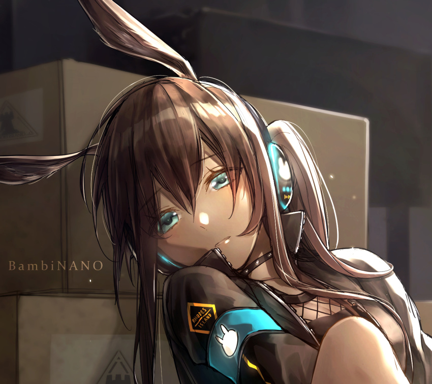 1girl amiya_(arknights) animal_ears arknights armband artist_name bambi_nano bangs bare_legs black_choker black_jacket blue_armband blue_eyes box brown_hair bunny_ears cardboard_box choker commentary eyebrows_visible_through_hair fishnets hair_between_eyes head_tilt headphones highres indoors jacket jewelry kneehighs knees_up light_particles long_hair long_sleeves looking_at_viewer ring signature single_kneehigh sitting solo