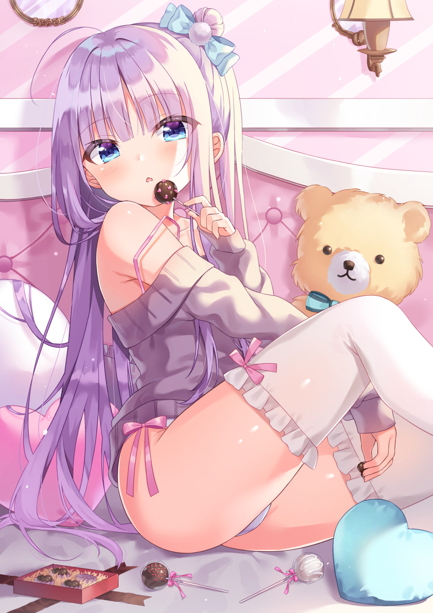 1girl :o absurdres ahoge arm_between_legs bare_shoulders bed bed_sheet blue_eyes blush box bra_strap candy commentary eyebrows_visible_through_hair food gift gift_box hair_between_eyes hair_bun hair_ribbon heart heart_pillow highres holding_chocolate holding_lollipop indoors knee_up lollipop long_hair looking_at_viewer off-shoulder_sweater off_shoulder on_bed original panties pillow purple_hair ribbon shiny shiny_hair siooooono sitting sitting_on_bed solo stuffed_animal stuffed_toy sweater teddy_bear thighhighs underwear wall_lamp white_legwear white_panties