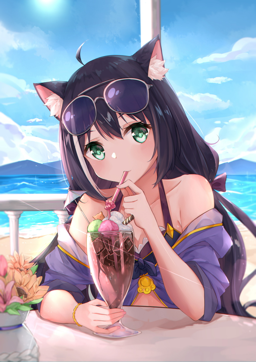 1girl absurdres ahoge animal_ear_fluff animal_ears bangs bare_shoulders beach bikini black_hair blue_sky blush bow bracelet cat_ears cloud collarbone cup day drinking_glass drinking_straw eyebrows_visible_through_hair eyewear_on_head green_eyes hair_between_eyes hair_bow hair_ribbon highres jewelry kyaru_(princess_connect) long_hair looking_at_viewer low_twintails mountain multicolored_hair ocean off_shoulder outdoors princess_connect! princess_connect!_re:dive purple_bow purple_ribbon ribbon sitting sky solo streaked_hair sunglasses swimsuit table to_naive twintails very_long_hair water white_hair