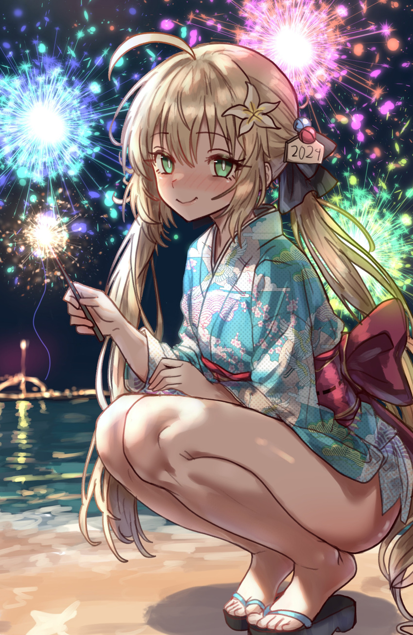 1girl 2024 absurdres ahoge alternate_costume artoria_caster_(fate) artoria_pendragon_(fate) bare_legs beach black_bow blonde_hair blue_kimono bow crane_print ebora english_commentary fate/grand_order fate_(series) fireworks floral_print flower green_eyes hair_between_eyes hair_bow hair_flower hair_ornament happy_new_year heel_up highres holding_fireworks japanese_clothes kimono long_hair looking_at_viewer night night_sky obi ocean outdoors print_kimono sandals sash sky smile solo sparkler squatting thighs toes twintails yukata