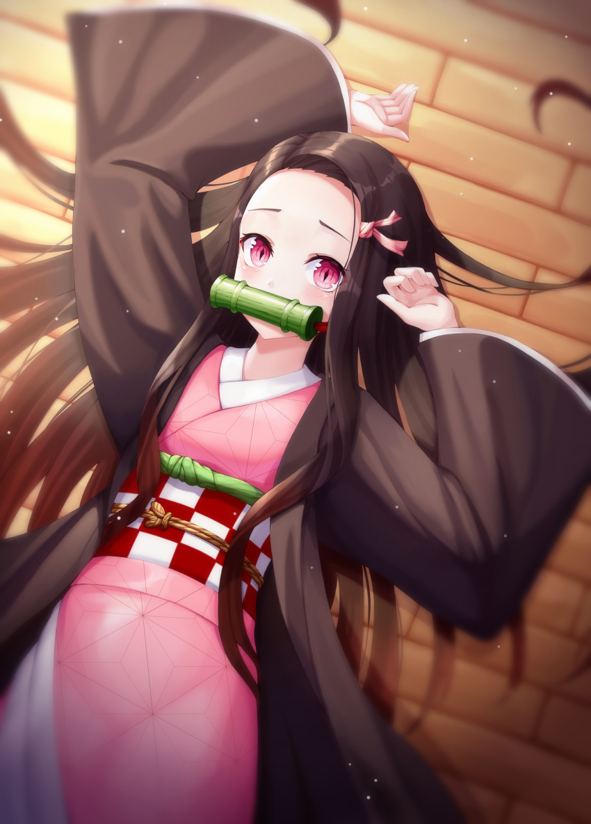 1girl absurdres arms_up bamboo bit_gag black_hair black_haori blush checkered_obi commentary_request gag hair_ribbon haori highres japanese_clothes kamado_nezuko kimetsu_no_yaiba kimono long_sleeves lying mouth_hold multicolored_hair on_back orange_hair pink_eyes pink_kimono pink_ribbon ribbon ryon_y0421 slit_pupils solo two-tone_hair wide_sleeves