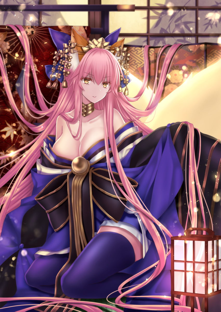 1girl animal_ear_fluff animal_ears bell blue_kimono blue_legwear breasts cleavage collarbone crown eyebrows_visible_through_hair fate/grand_order fate_(series) fox_ears fox_girl fox_tail highres indoors japanese_clothes jingle_bell kimono large_breasts long_hair off_shoulder pink_hair sitting solo tail tamamo_(fate)_(all) tamamo_no_mae_(fate) very_long_hair yellow_eyes yuzushiro