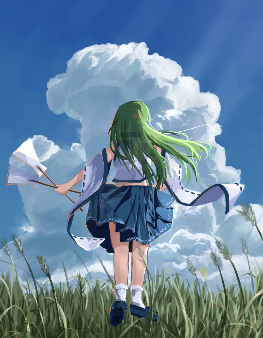 1girl absurdres blue_footwear blue_skirt blue_sky commentary detached_sleeves english_commentary from_behind gohei grass green_hair highres holding kochiya_sanae long_hair ourie outdoors ribbon-trimmed_sleeves ribbon_trim skirt sky socks solo touhou white_socks