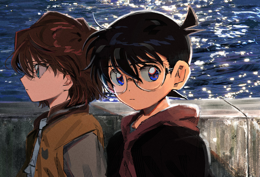 1boy 1girl black-framed_eyewear black_hair blue_eyes brown_hair child closed_mouth edogawa_conan floating_hair glasses green_eyes haibara_ai hair_between_eyes highres hood hood_down hoodie looking_at_viewer meitantei_conan ocean outdoors profile segami short_hair sunlight