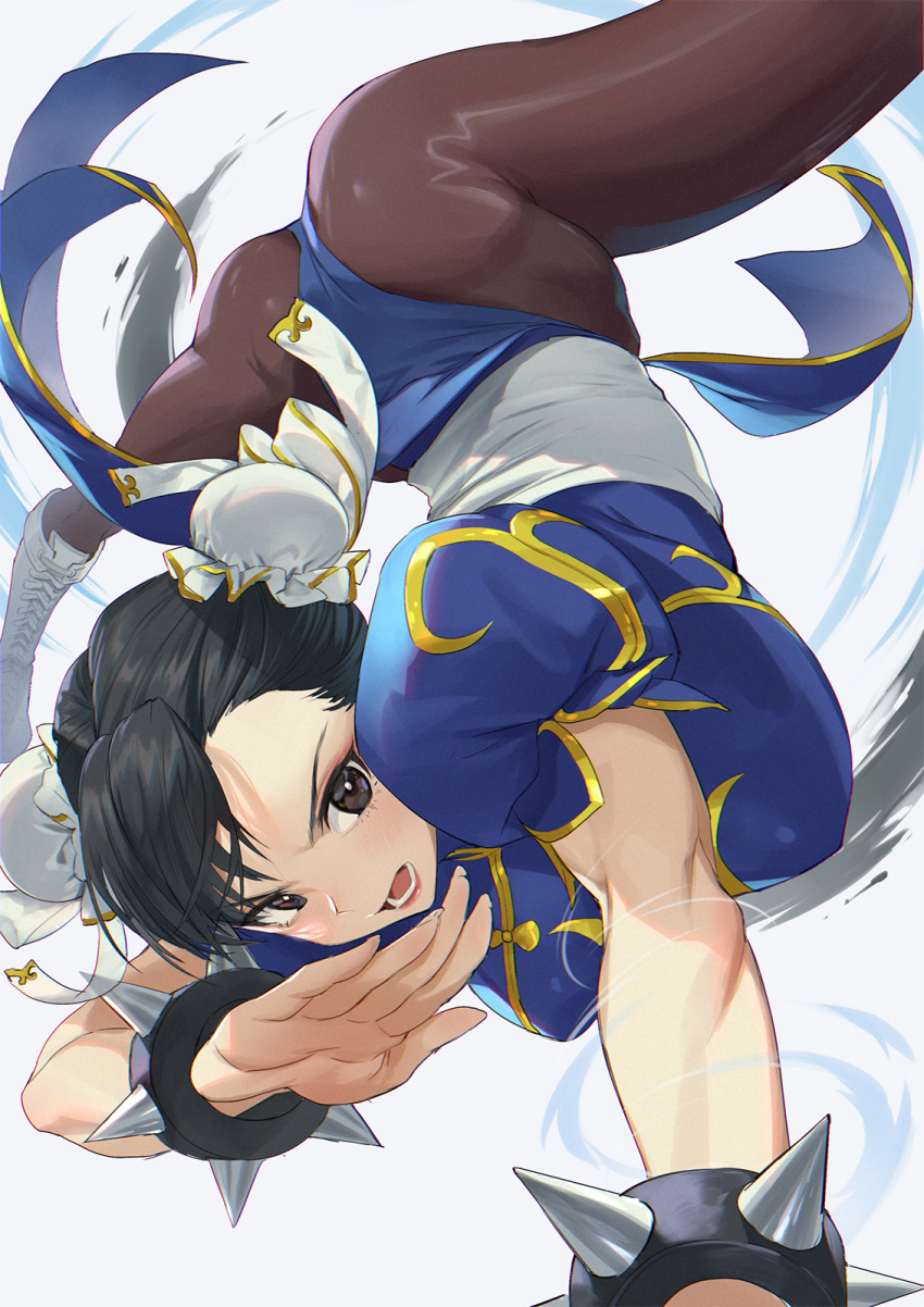 1girl ass black_hair blue_dress boots bracelet brown_eyes brown_legwear bun_cover china_dress chinese_clothes chun-li cross-laced_footwear double_bun dress highres jewelry mhk_(mechamania) open_hand open_mouth pantyhose pelvic_curtain puffy_short_sleeves puffy_sleeves sash short_sleeves spiked_bracelet spikes spinning_bird_kick street_fighter thighs white_footwear