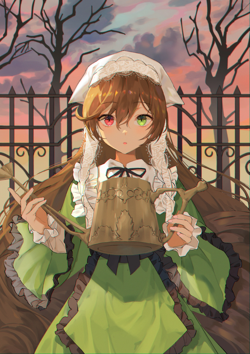 1girl bangs bare_tree black_ribbon bonnet brown_hair clothing_request cloud cloudy_sky day dress eyebrows_visible_through_hair fence frills green_dress green_eyes heterochromia highres holding holding_watering_can long_hair long_sleeves looking_at_viewer neck_ribbon parted_lips ppyono puffy_sleeves red_eyes red_sky ribbon rozen_maiden sky solo suiseiseki tree watering_can white_headwear wide_sleeves