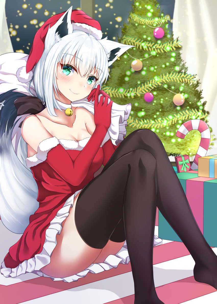 1girl absurdres alternate_costume animal_ears bell bell_choker black_legwear breasts candy candy_cane choker christmas christmas_lights christmas_ornaments christmas_present christmas_tree city_lights cleavage commentary_request curtains dress elbow_gloves food fox_ears fox_tail garland_(decoration) gloves green_eyes hands_up hat hibika highres holding holding_sack hololive indoors jingle_bell knees_up legs medium_breasts red_dress red_gloves sack santa_costume santa_hat shirakami_fubuki sitting smile solo star_(symbol) strapless strapless_dress tail thighhighs thighs virtual_youtuber white_choker white_hair window zettai_ryouiki