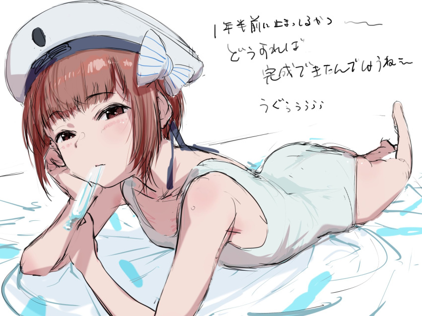 1girl black_eyes bouen brown_hair clothes_writing hat highres kantai_collection lying mouth_hold on_stomach one-piece_swimsuit peaked_cap sailor_hat school_swimsuit short_hair solo swimsuit translation_request white_headwear white_swimsuit z3_max_schultz_(kantai_collection)