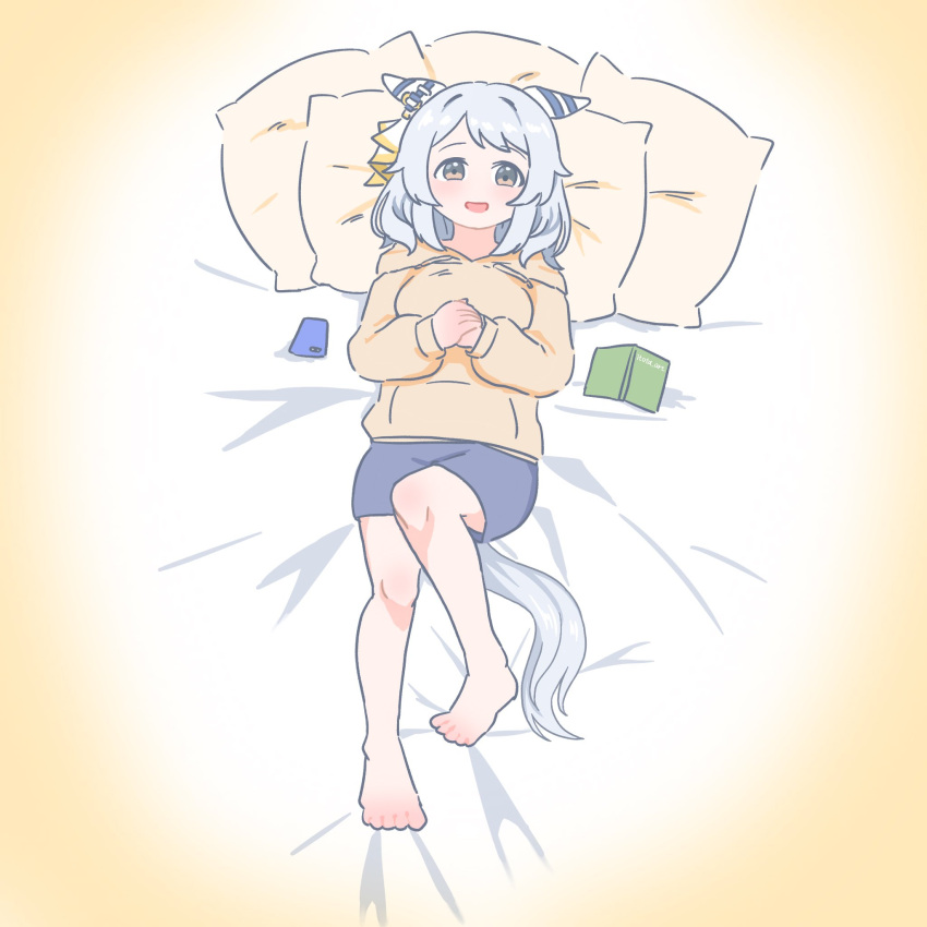 1girl animal_ears barefoot bed_sheet blue_shorts book breasts cellphone ear_covers full_body highres hishi_miracle_(umamusume) hood hoodie horse_ears horse_girl horse_tail itota_art long_sleeves looking_at_viewer medium_hair on_bed open_mouth own_hands_together phone pillow shorts small_breasts smartphone smile solo tail toes umamusume white_hair yellow_eyes yellow_hoodie