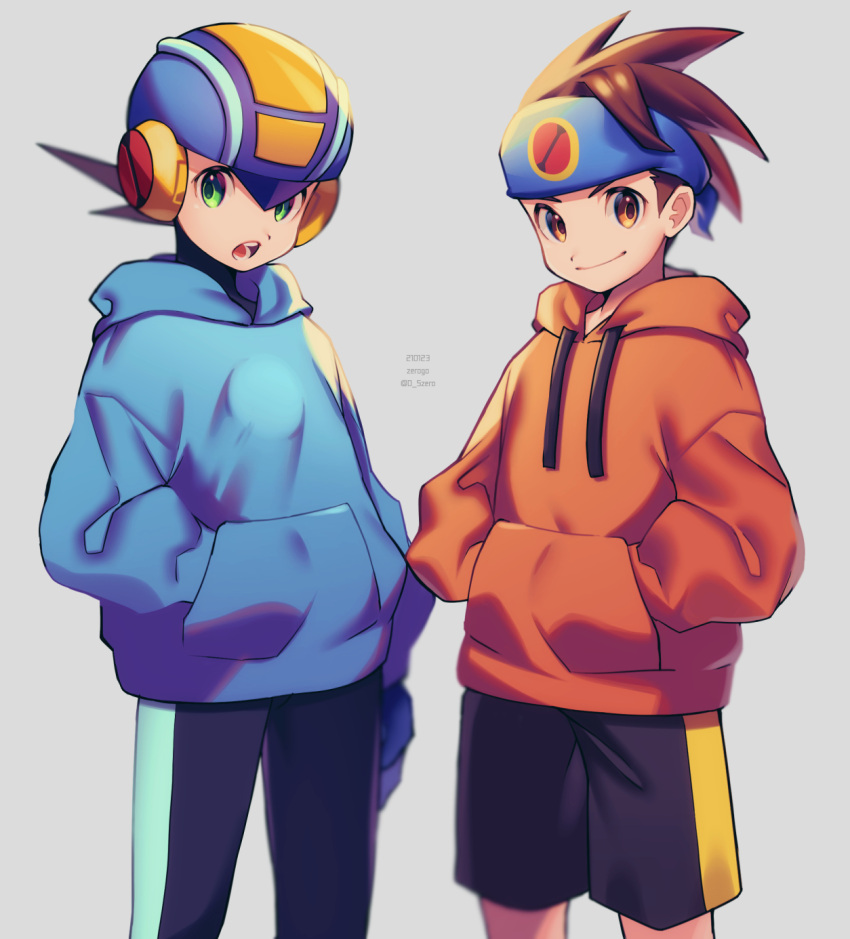 2boys arm_at_side artist_name black_pants black_shorts blue_headband blue_headwear blue_hoodie blurry bodysuit brown_eyes brown_hair closed_mouth commentary_request cowboy_shot dated depth_of_field green_eyes grey_background hand_in_pocket hands_in_pockets headband helmet highres hikari_netto hood hood_down hoodie looking_at_viewer male_focus multiple_boys netnavi open_mouth orange_hoodie pants rockman rockman_exe rockman_exe_(character) short_hair shorts simple_background smile spiked_hair standing teeth twitter_username zero-go