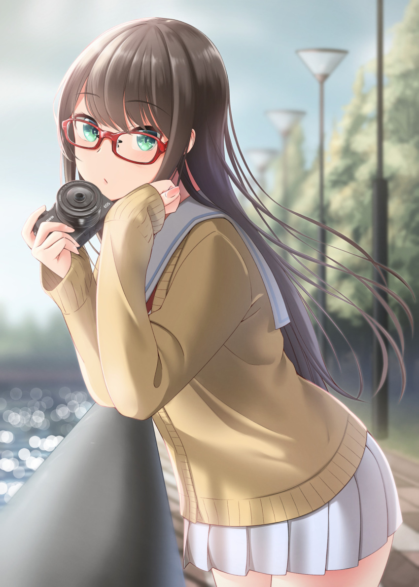 1girl :o brown_hair brown_shirt camera glasses green_eyes highres holding holding_camera lamppost leaning leaning_forward long_hair long_sleeves looking_at_viewer looking_back nekobaka open_mouth original outdoors pleated_skirt railing red-framed_eyewear sailor_collar school_uniform serafuku shirt skirt sky solo standing tree uniform water white_sailor_collar white_skirt