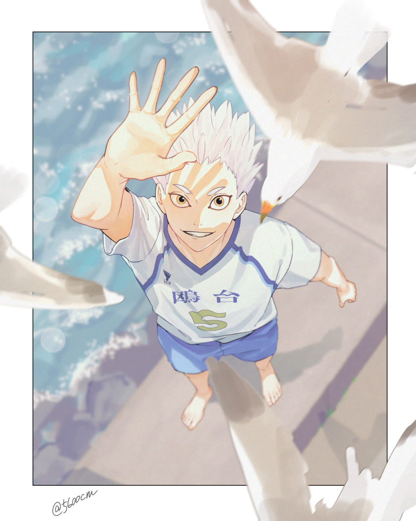 1boy 5600cm absurdres arm_up barefoot bird border from_above grin haikyuu!! highres hoshiumi_kourai huge_filesize looking_at_viewer male_focus ocean seagull short_hair smile sportswear standing twitter_username volleyball_uniform white_hair yellow_eyes