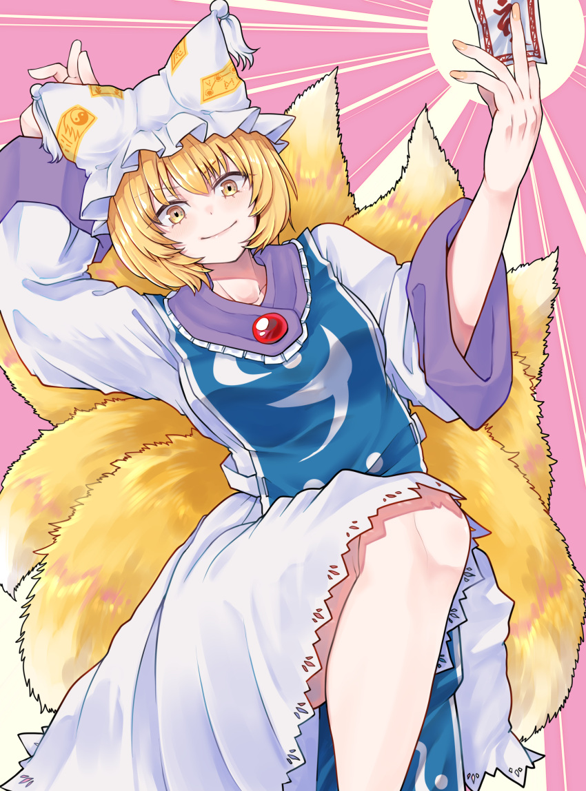 1girl absurdres animal_ears arms_up between_fingers blonde_hair breasts dress feet_out_of_frame fox_ears fox_tail hat highres large_breasts looking_at_viewer multiple_tails ofuda pillow_hat purple_background short_hair smile solo sunburst sunburst_background tabard tail toluda touhou v-shaped_eyebrows white_dress yakumo_ran yellow_eyes