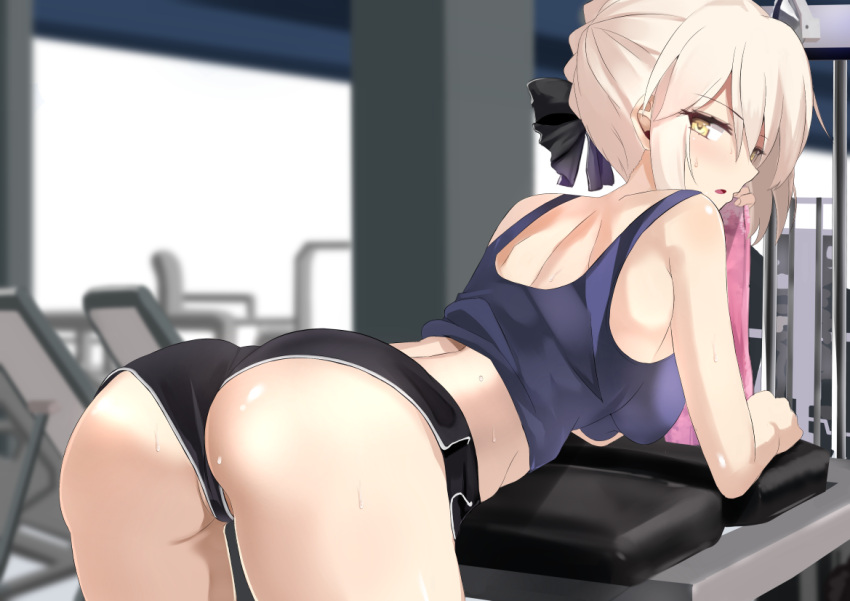 1girl artoria_pendragon_(all) ass back bent_over blonde_hair blush breasts fate/grand_order fate_(series) kesoshirou looking_at_viewer midriff open_mouth saber_alter shorts solo sweat tank_top towel yellow_eyes