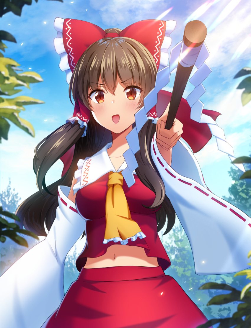 1girl :d arm_up ascot bangs blurry bow brown_eyes brown_hair cloud cloudy_sky commentary_request day depth_of_field detached_sleeves eyebrows_visible_through_hair foreshortening frilled_bow frilled_hair_tubes frilled_shirt_collar frills gohei hair_between_eyes hair_bow hair_tubes hakurei_reimu highres holding holding_stick leaf light_blush light_particles long_hair long_sleeves looking_at_viewer midriff mikomiko_(mikomikosu) navel open_mouth outdoors red_bow red_skirt red_vest sidelocks skirt skirt_set sky smile solo stick touhou v-shaped_eyebrows vest wide_sleeves yellow_neckwear