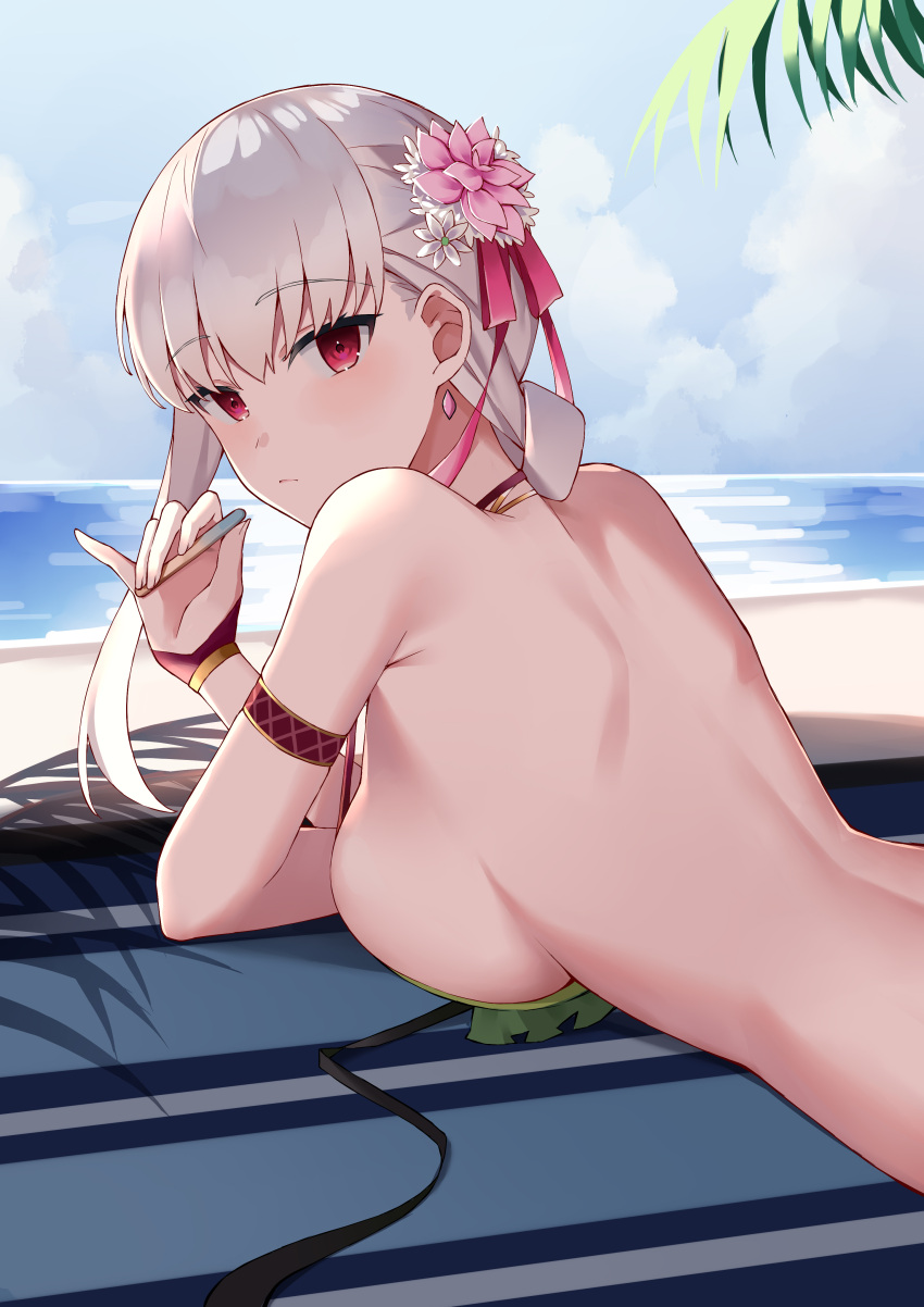 1girl absurdres armlet back bangs bare_back bare_shoulders beach bikini bikini_top blue_sky blush bracelet braid braided_ponytail breast_press breasts commentary earrings fate/grand_order fate_(series) flower green_bikini hair_flower hair_ornament hair_ribbon highres jewelry kama_(fate) kama_(swimsuit_avenger)_(fate) large_breasts long_hair looking_at_viewer lotus lying necklace ocean on_stomach pillow_(blackpirou) popsicle_stick red_eyes ribbon shore silver_hair sky solo swimsuit untied untied_bikini
