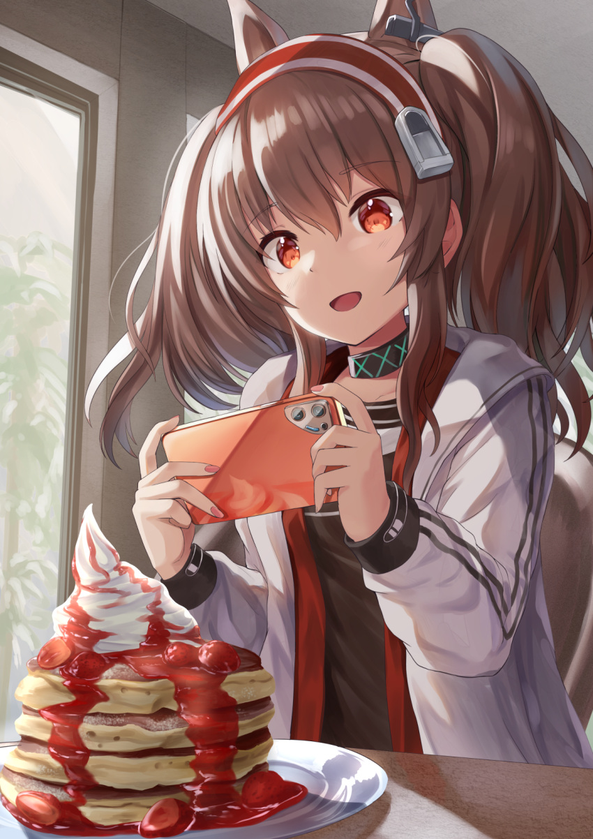 1girl akabane_hibame angelina_(arknights) animal_ears arknights bangs brown_hair cellphone commentary earpiece extra_ears eyebrows_visible_through_hair food fox_ears fox_girl highres infection_monitor_(arknights) jacket long_hair pancake phone red_eyes smartphone solo taking_picture twintails white_jacket