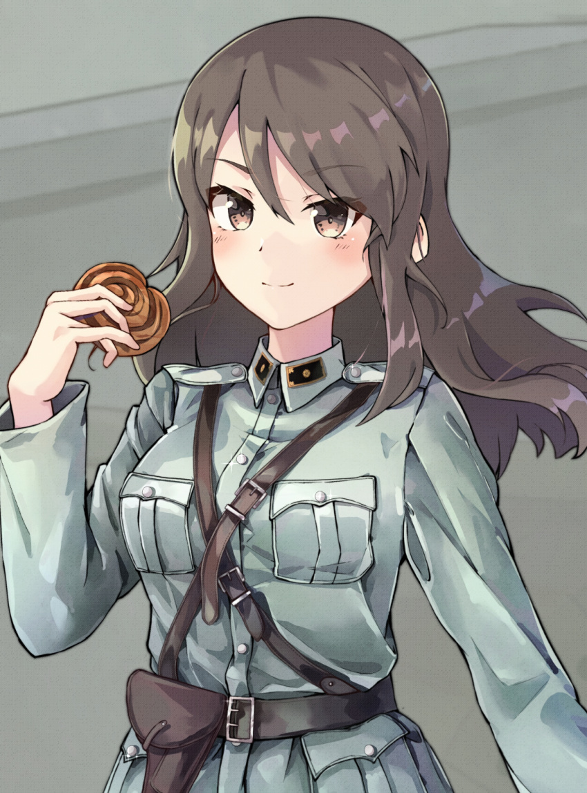 1girl alternate_costume bangs belt black_belt blue_jacket brown_eyes brown_hair cinnamon_roll closed_mouth commentary eyebrows_visible_through_hair finnish_army food girls_und_panzer highres himeyamato holding holding_food holster jacket long_hair long_sleeves looking_at_viewer mika_(girls_und_panzer) military military_uniform no_hat no_headwear sam_browne_belt smile solo uniform upper_body wind world_war_ii