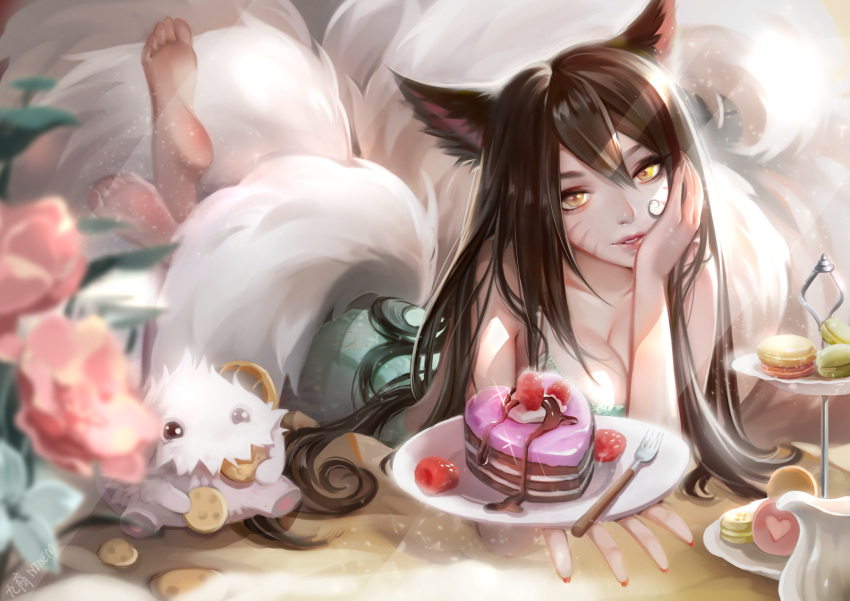 1girl ahri_(league_of_legends) animal_ears bangs barefoot breasts brown_hair cake cleavage collarbone cookie dress feet_up food fork fox_ears fox_girl fox_tail green_dress highres large_breasts league_of_legends long_hair lying on_stomach orange_eyes plate poro_(league_of_legends) shiny shiny_hair smile soles solo tail xiuluoyi00