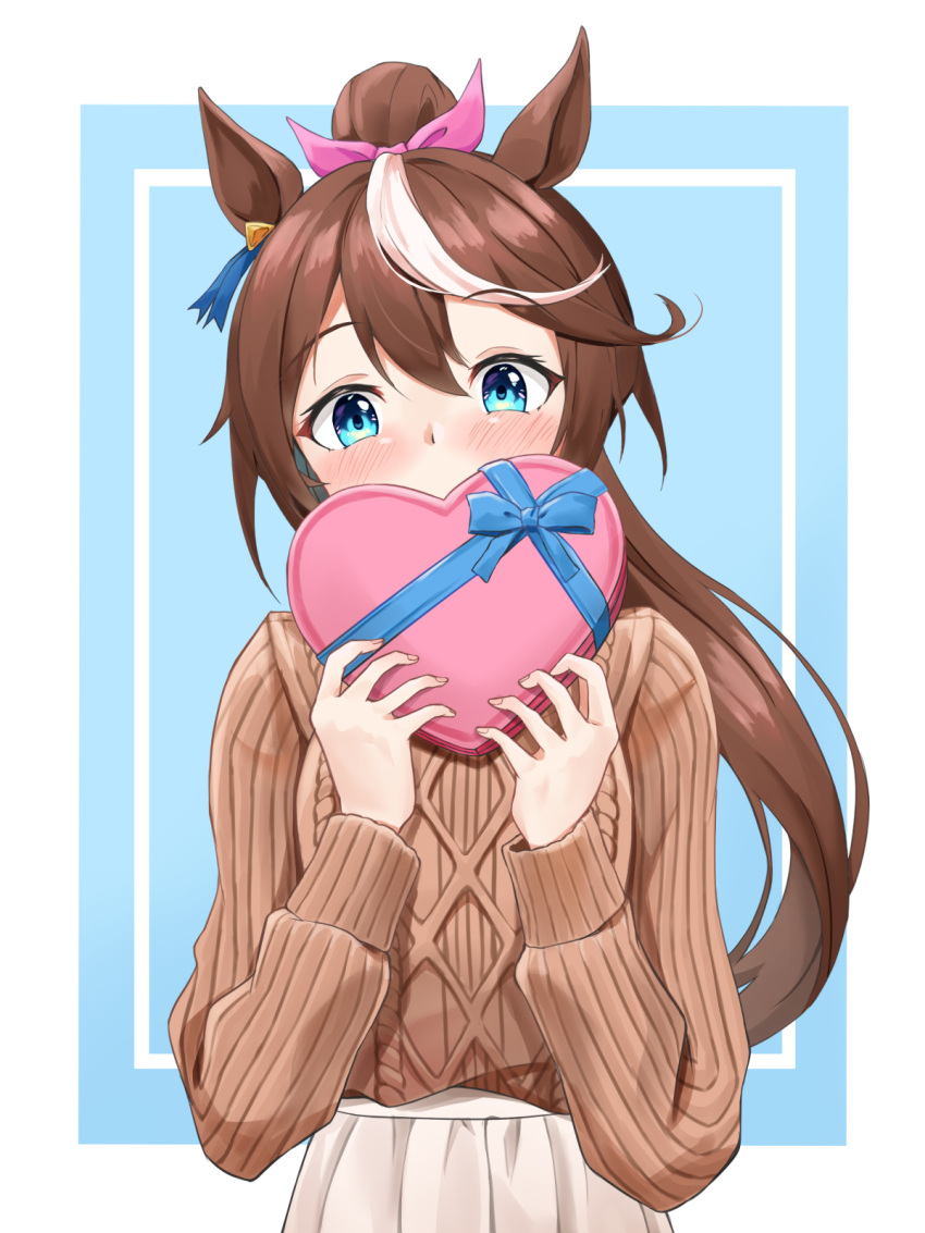 1girl animal_ears bangs blue_background blush border bow brown_hair brown_sweater chocolate commentary_request cowboy_shot dusu_(htkj) eyebrows_visible_through_hair food hair_between_eyes hands_up heart highres holding holding_chocolate holding_food holding_heart horse_ears horse_girl light_brown_hair long_hair long_sleeves looking_at_viewer multicolored_hair outside_border pink_bow pleated_skirt ponytail sidelocks skirt solo streaked_hair sweater sweater_tucked_in tokai_teio_(umamusume) two-tone_hair umamusume valentine white_border white_skirt