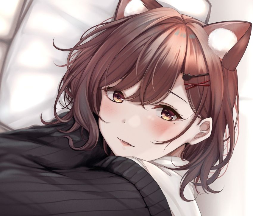 1girl animal_ear_fluff animal_ears bangs blush brown_eyes brown_hair cat_ears cat_girl eyebrows_behind_hair fangs hair_ornament hairclip highres higuchi_madoka idolmaster idolmaster_shiny_colors lips looking_at_viewer medium_hair mole mole_under_eye off_shoulder on_bed parted_lips pillow portrait shirt smile solo swept_bangs white_shirt yuzuyu_(hyui)