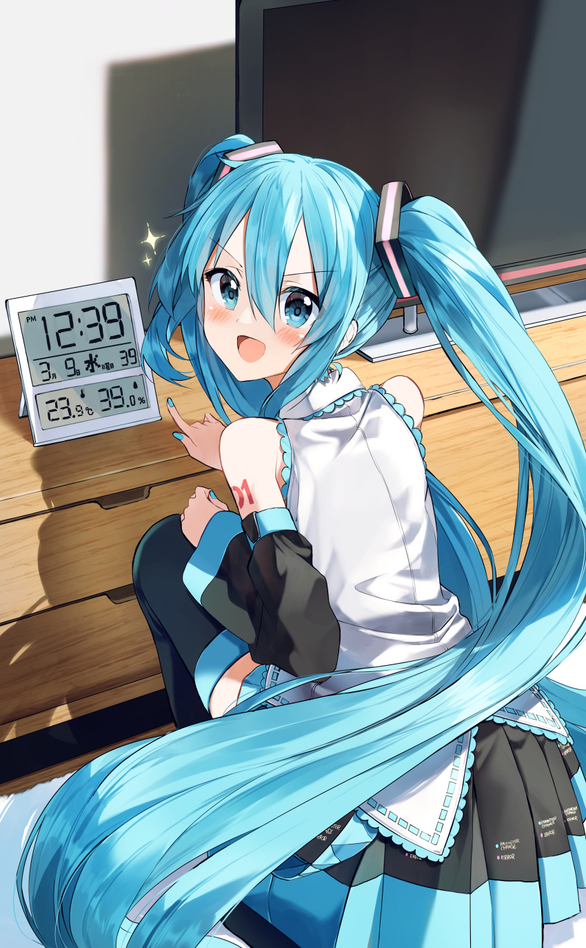 1girl 39 :d absurdres bangs black_legwear black_skirt black_sleeves blue_eyes blue_hair blue_nails blush clock commentary_request detached_sleeves digital_clock eyebrows_visible_through_hair flat_screen_tv from_behind hair_between_eyes hatsune_miku highres indoors long_hair long_sleeves looking_at_viewer looking_back nail_polish number_pun partial_commentary pentagon_(railgun_ky1206) pleated_skirt pointing shirt skirt sleeveless sleeveless_shirt smile solo sparkle squatting television thighhighs twintails v-shaped_eyebrows very_long_hair vocaloid white_shirt wide_sleeves