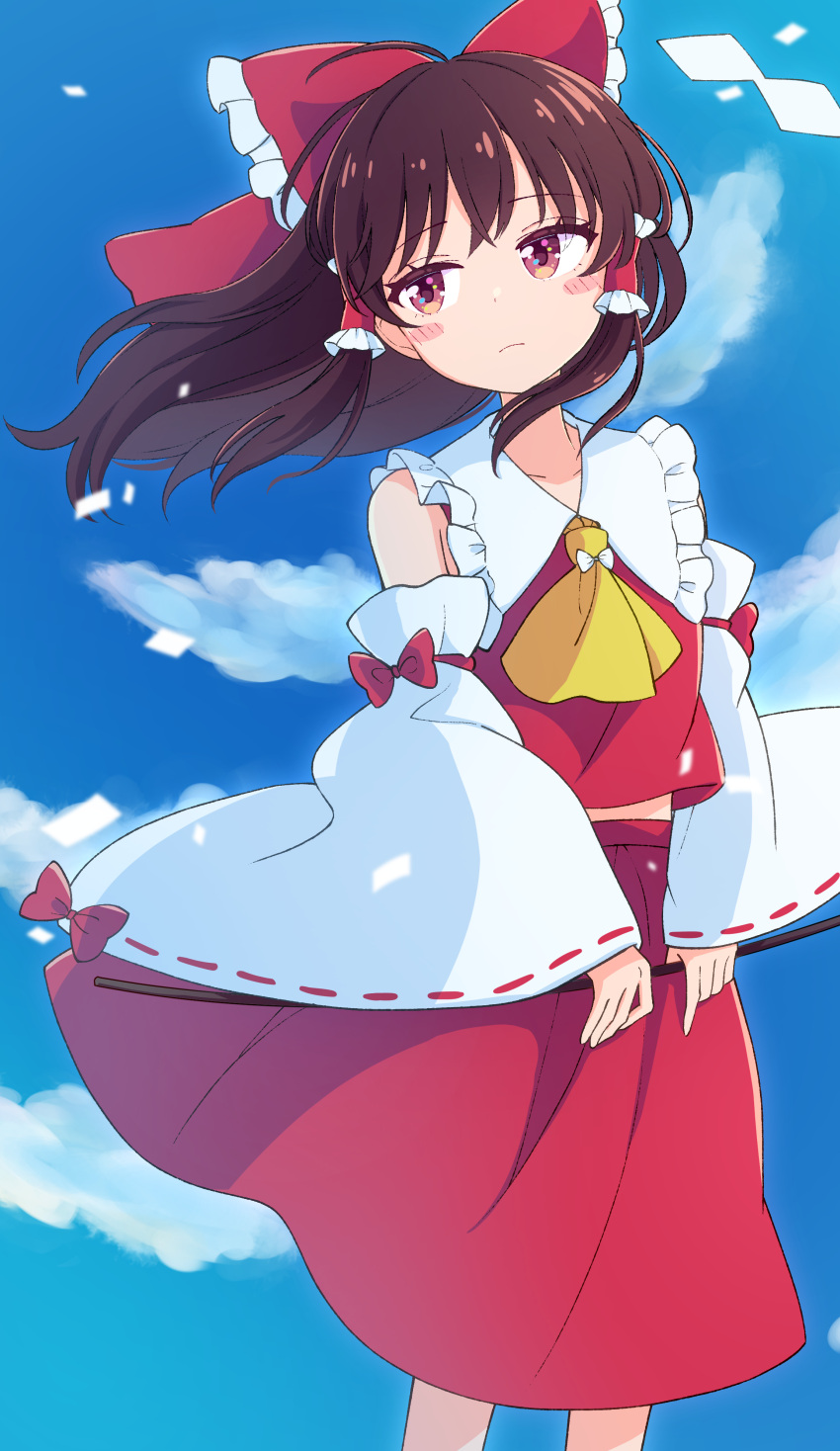 1girl absurdres ascot blue_sky bow brown_hair cloud day detached_sleeves frills hair_bow hair_tubes hakurei_reimu haruki_reimari highres long_hair looking_at_viewer red_bow red_eyes red_skirt ribbon-trimmed_sleeves ribbon_trim sidelocks skirt skirt_set sky solo standing touhou wide_sleeves yellow_neckwear