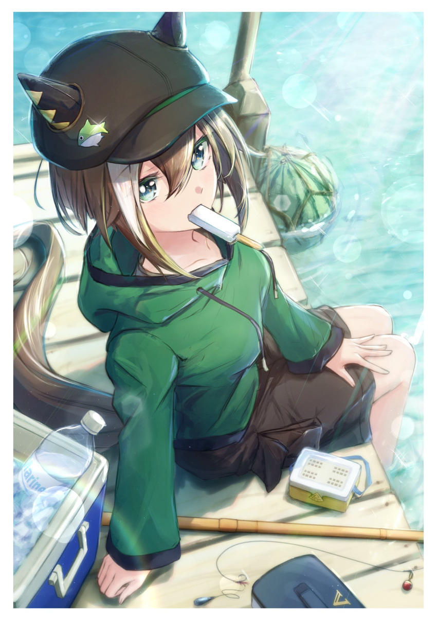 1girl animal_ears black_headwear black_shorts blue_eyes brown_hair cheval_grand_(umamusume) ear_covers ears_through_headwear fishing_rod food food_in_mouth from_above green_sweater hair_between_eyes highres horse_ears horse_girl multicolored_hair partially_submerged popsicle popsicle_in_mouth sarasuty shorts solo streaked_hair sweater umamusume white_hair