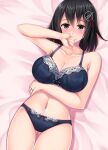  1girl absurdres ass_visible_through_thighs bed_sheet black_bra black_eyes black_hair black_panties blush bra breasts cleavage collarbone cowboy_shot eyebrows_visible_through_hair fingernails haguro_(kancolle) hair_between_eyes hair_ornament highres jewelry kantai_collection large_breasts navel panties ring ruin_re_birth short_hair solo underwear wedding_band 