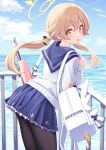  1girl bag bangs blue_archive blue_sailor_collar cloud day deadnooodles gun halo hifumi_(blue_archive) highres horizon leaning_forward light_brown_hair long_hair long_sleeves looking_at_viewer looking_back low_twintails ocean open_mouth pantyhose pleated_skirt railing sailor_collar shirt skirt sky sling solo standing twintails weapon yellow_eyes 