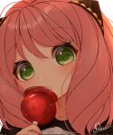  1girl anya_(spy_x_family) bangs blush bow candy_apple child commentary dekzyl face food green_eyes hair_ornament hairpods highres holding holding_food looking_at_viewer making-of_available medium_hair open_mouth pink_hair portrait signature solo spy_x_family white_bow 