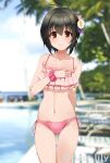  ahoge arm_behind_back ass_visible_through_thighs bangs black_hair blurry blurry_background brown_eyes collarbone commentary_request day eyebrows_visible_through_hair flower frilled_swimsuit frills hair_between_eyes hair_flower hair_ornament hand_on_own_chest highres idolmaster idolmaster_cinderella_girls kohinata_miho light_blush looking_at_viewer navel outdoors paopao pink_swimsuit short_hair sidelocks smile solo stomach swimsuit thighs twitter_username 