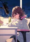  1girl absurdres bangs black_shorts bottle brown_hair chair city_lights cityscape closed_mouth cover_image from_side gaming_chair head_rest headphones headphones_around_neck highres hood hood_down hoodie indoors koi_wa_yozora_wo_watatte long_sleeves looking_at_viewer looking_to_the_side microphone night official_art on_chair purple_eyes short_hair shorts shugao sitting smile solo table textless_version white_hoodie 