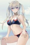  1girl bangs bikini black_bikini blonde_hair blush breasts cleavage closed_mouth eyebrows_visible_through_hair graf_zeppelin_(kancolle) hair_between_eyes hand_on_own_knee highres kantai_collection kasumi_(skchkko) large_breasts long_hair looking_at_viewer multicolored_bikini multicolored_clothes navel solo swimsuit twintails wet 