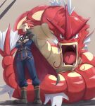  1boy alternate_color belt boots cape closed_mouth commentary_request crossed_arms frown gyarados highres itsudzumi jacket lance_(pokemon) long_sleeves male_focus pants pokemon pokemon_(game) pokemon_hgss red_hair shiny_pokemon short_hair spiked_hair standing 