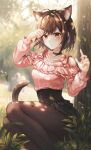  1girl absurdres animal_ear_fluff animal_ears arm_up bangs black_choker black_skirt blush brown_eyes brown_hair brown_legwear cat_ears cat_girl cat_tail choker closed_mouth day extra_ears feet_out_of_frame grass hand_up highres leaf leaf_on_head looking_at_viewer mirage_(rairudiseu) outdoors pantyhose pink_shirt project_sekai shinonome_ena shirt short_hair sitting skirt solo tail tree 