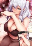  1girl black_bra black_legwear black_panties blue_eyes bra breasts cellphone cleavage commentary_request cowboy_shot highres kantai_collection kashima_(kancolle) large_breasts looking_at_viewer osterei panties pantyhose phone phone_screen sitting smartphone solo twintails underwear wavy_hair white_hair 
