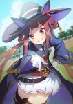  1girl animal_ears belt blurry blurry_background blush commentary gloves grin hair_rings hat highres horse_ears horse_girl konatsu_hare long_hair looking_at_viewer necktie pointing pointing_at_viewer purple_eyes racetrack smile solo sweep_tosho_(umamusume) twintails umamusume witch_hat 